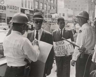 When NAACP national secretary Roy Wilkins joined Evers in pickee F. W. Woolworth store in downtown Jackson, both men were swiftly arrested by local police brandishing electric cattle prods. This press photograph documenting the arrest appeared in the New York Times on June 2, 1963—just ten days before Evers's assassination by white supremacist Byron de la Beckwith.