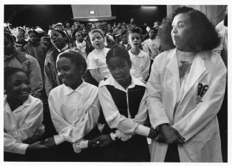 Dorie Ladner, social worker, with D.C. public school students during Negro History Month event at D.C. General Hospital. 1991. Photo by Nancy Andrews for the Washington Post.