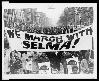 A march of 15,000 in Harlem in solidarity with the Selma voting rights struggle. World Telegram & Sun photo by Stanley Wolfson. Library of Congress.